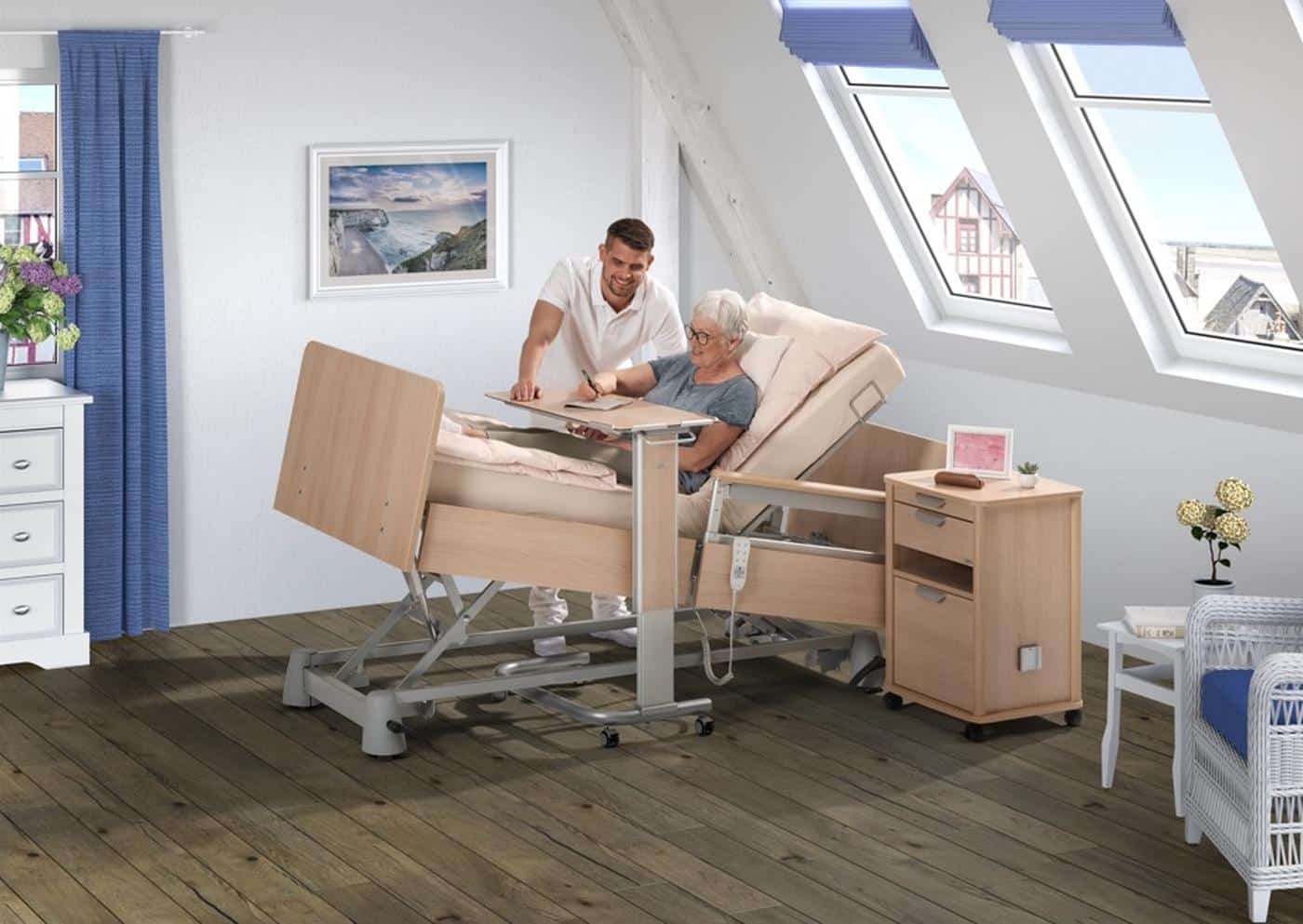Wissner-bosserhoff Carisma SC profiling bed in use with a carer and resident