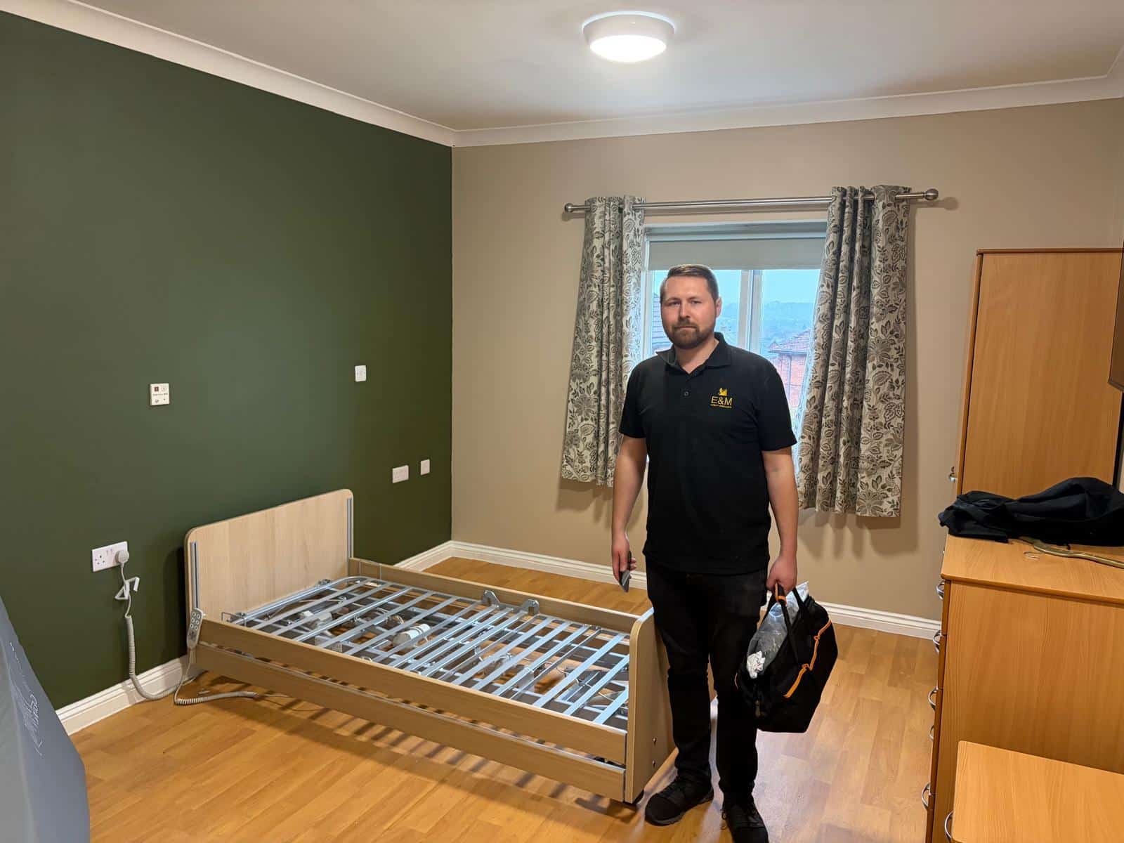 E&M engineer servicing a profiling bed at a care home