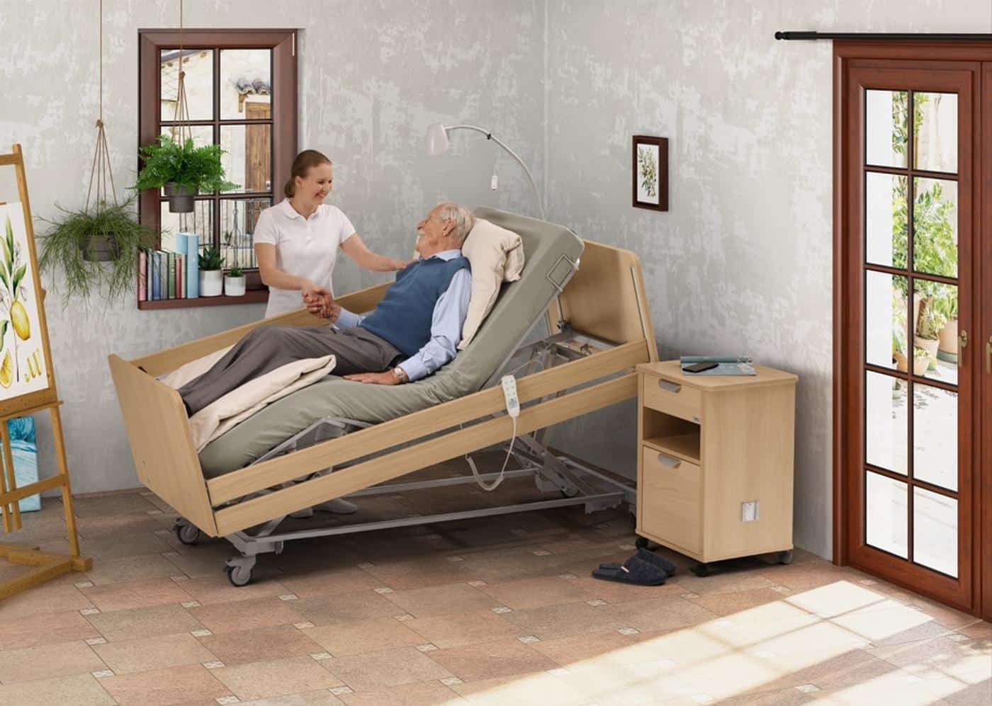 Wissner-bosserhoff Movita SC profiling bed in use with a carer and resident
