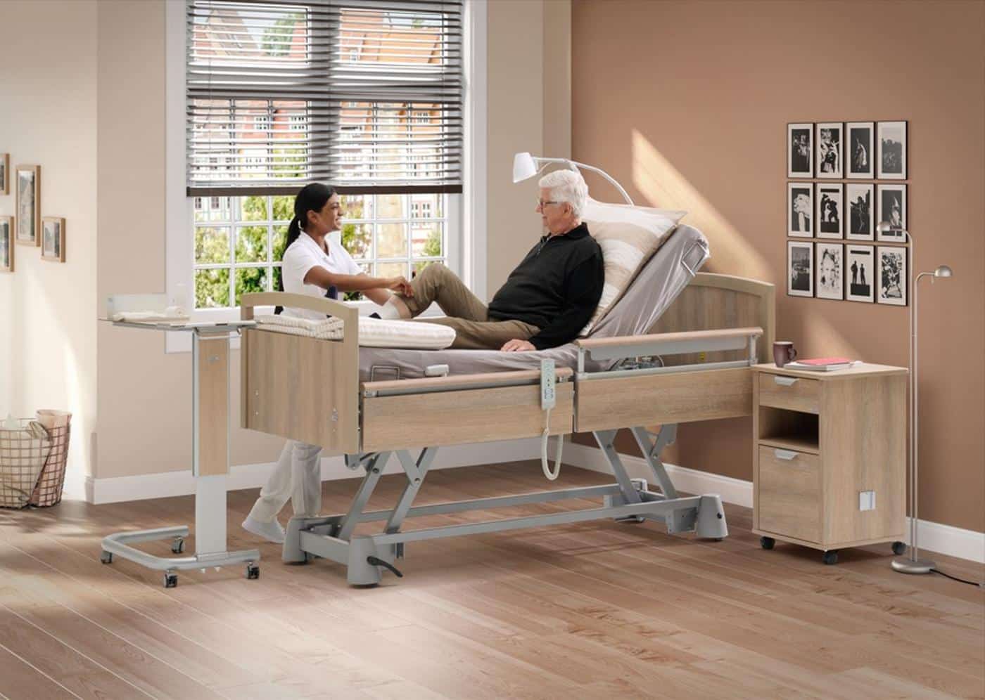 Wissner-bosserhoff Sentida SC profiling bed with a carer and resident