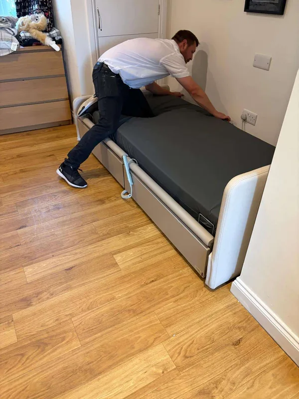 E&M engineer setting up a bed on site